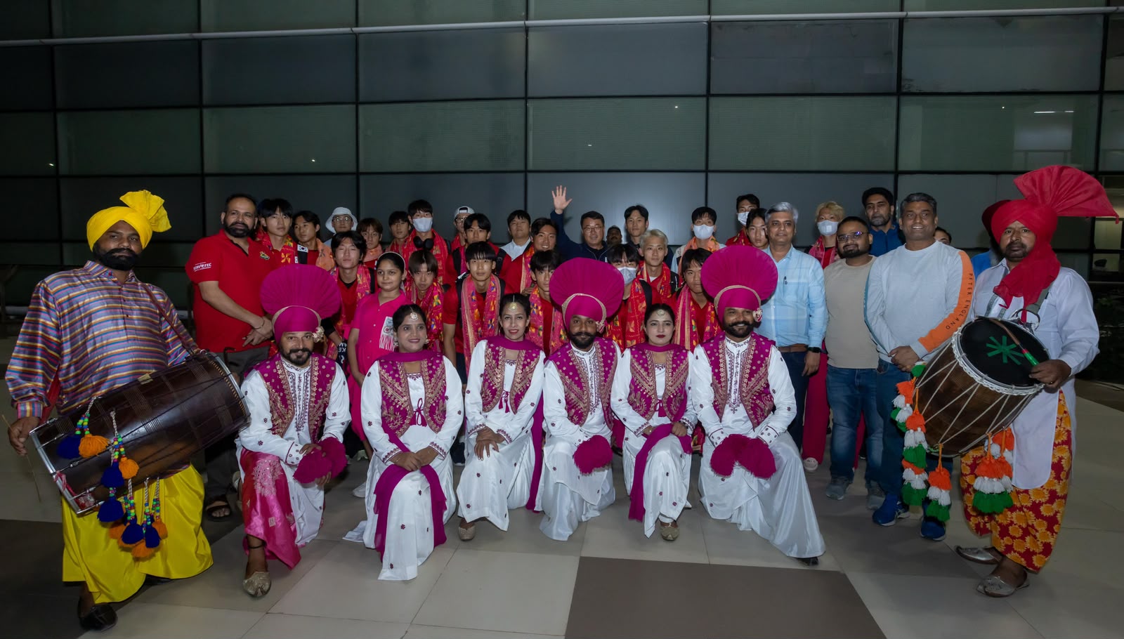 South Korean Men’s Hockey team receives Hearty & Rousing Punjabi Welcome at Mohali Airport with Dhol, Bhangra & Phulkaris